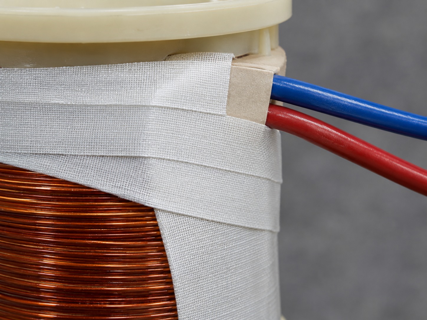 Glass cloth acrylic adhesive tape holding down leads on an electrical coil